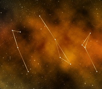Three star constellations within orange clouds on a black background
